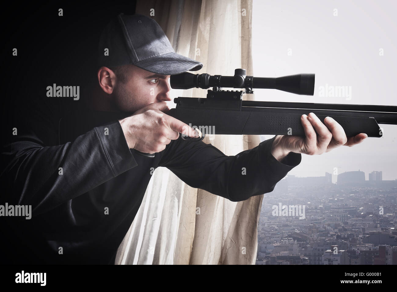 portrait of caucasian sniper with rifle Stock Photo