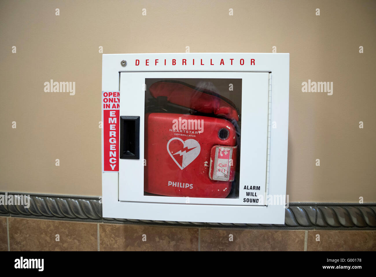 Defibrillator near public bathrooms in a shopping mall. Stock Photo