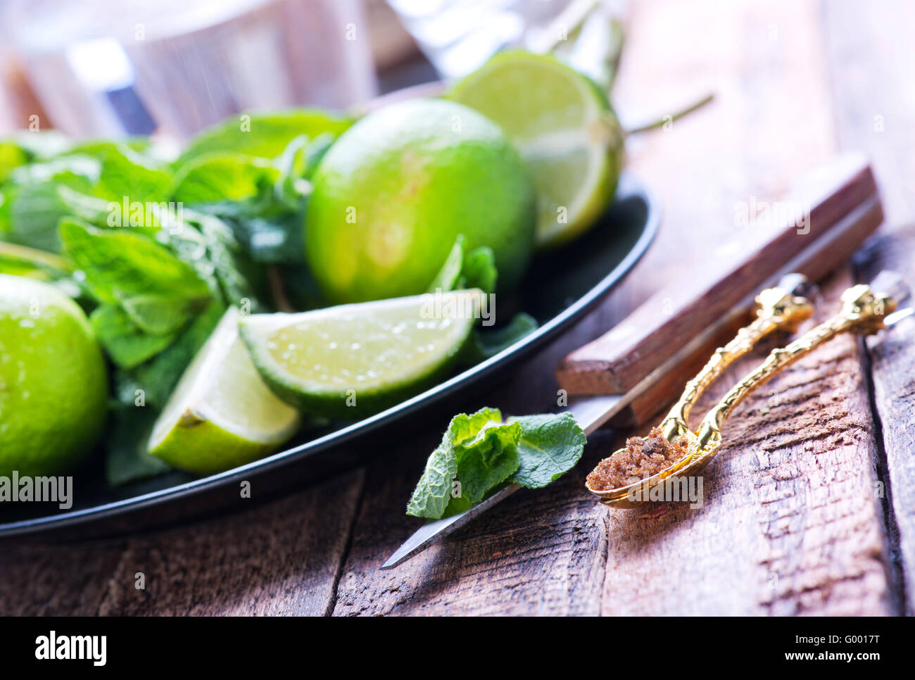 lime,sugar and fresh mint on a table Stock Photo