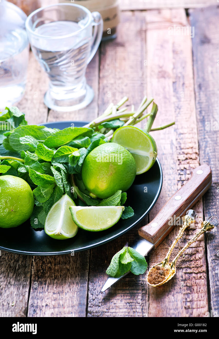 lime,sugar and fresh mint on a table Stock Photo