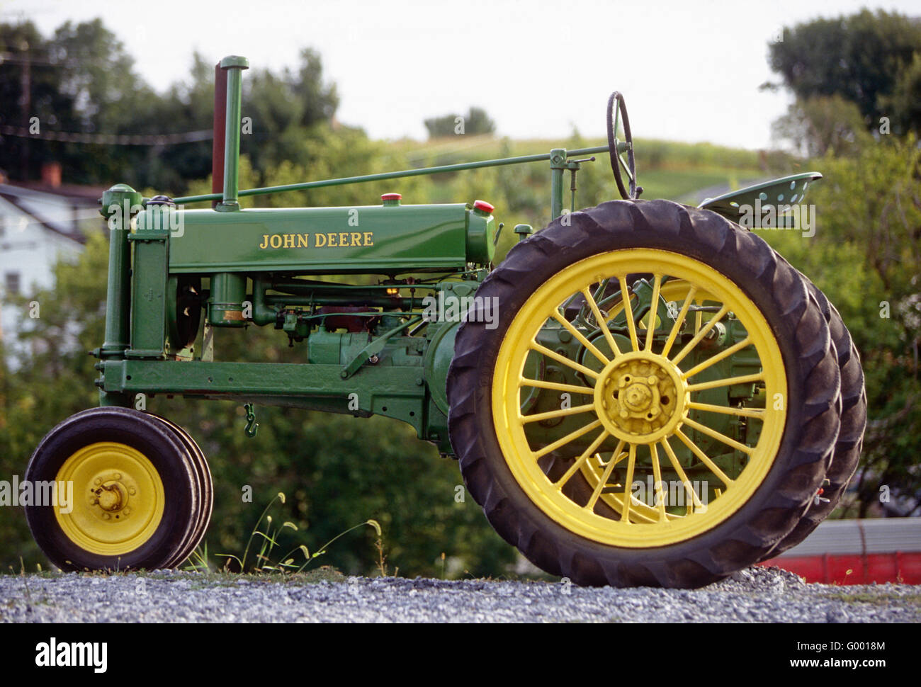Mint condition antique John Deere tractor on central Pennsylvania farm Stock Photo