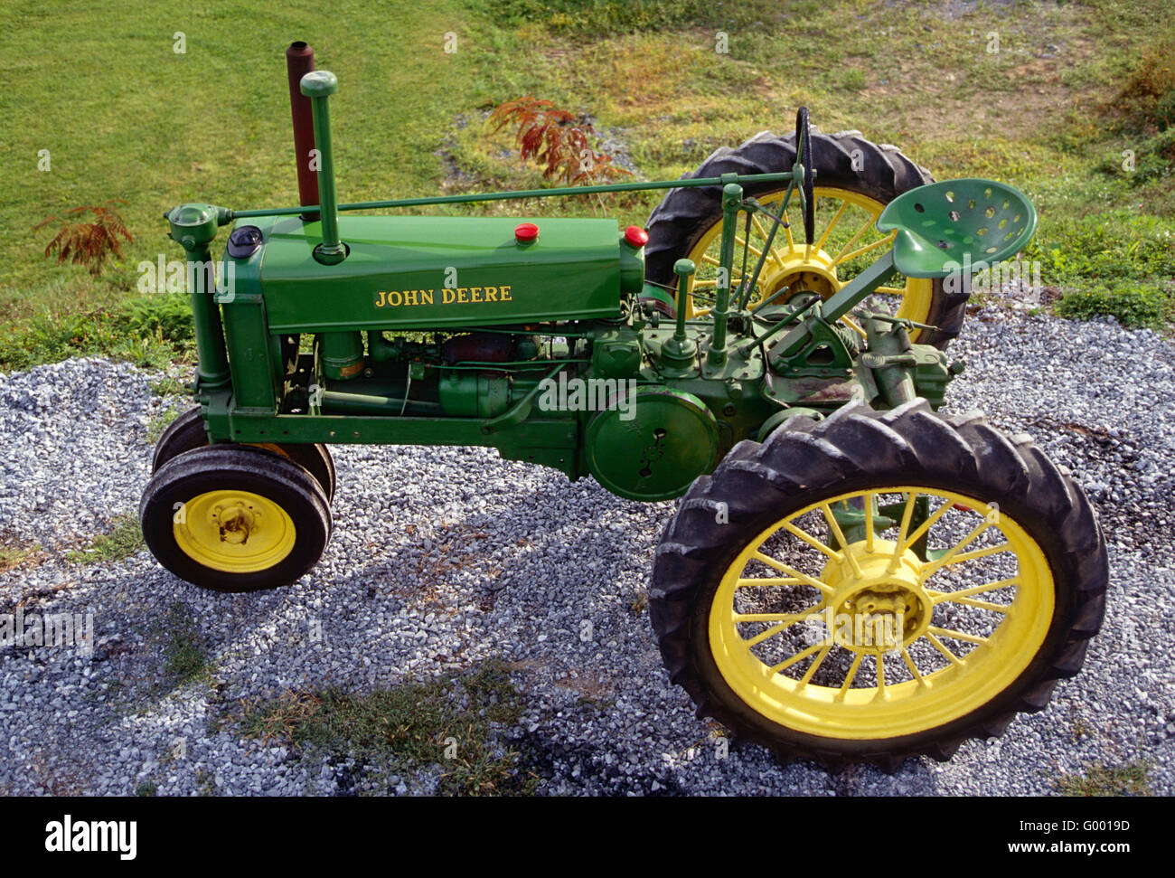 Mint condition antique John Deere tractor on central Pennsylvania farm Stock Photo