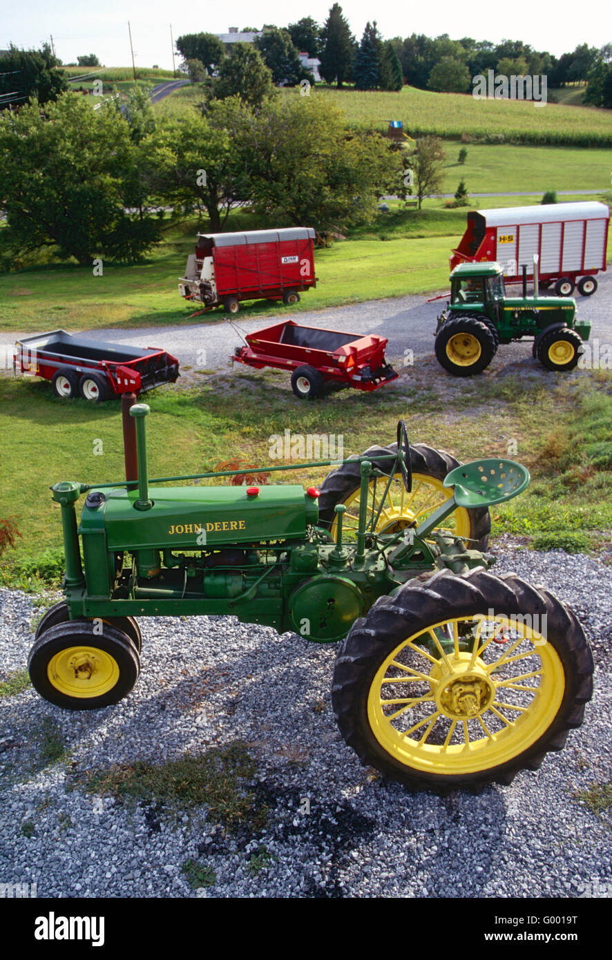 Mint condition antique John Deere tractor & other farm equipment on central Pennsylvania farm Stock Photo