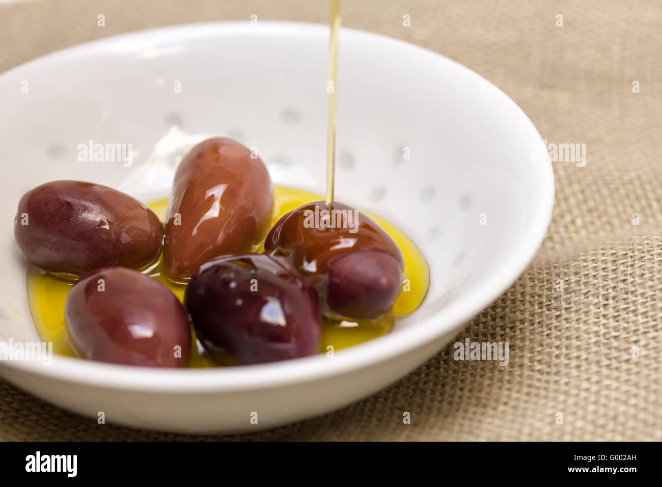 Olives in olive oil Stock Photo Alamy