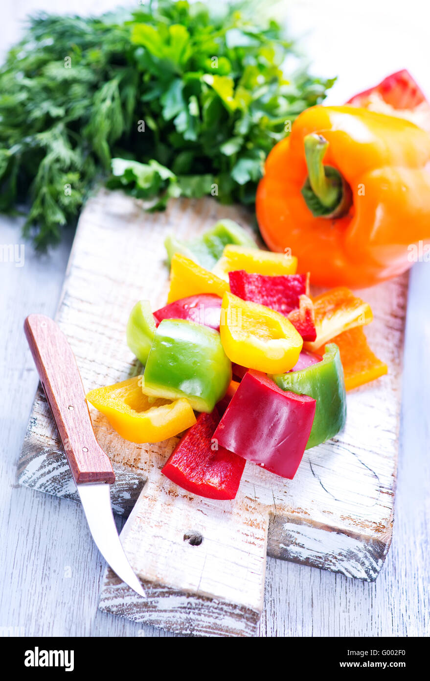 Table Peper color sweet pepper on the wooden table Stock Photo - Alamy