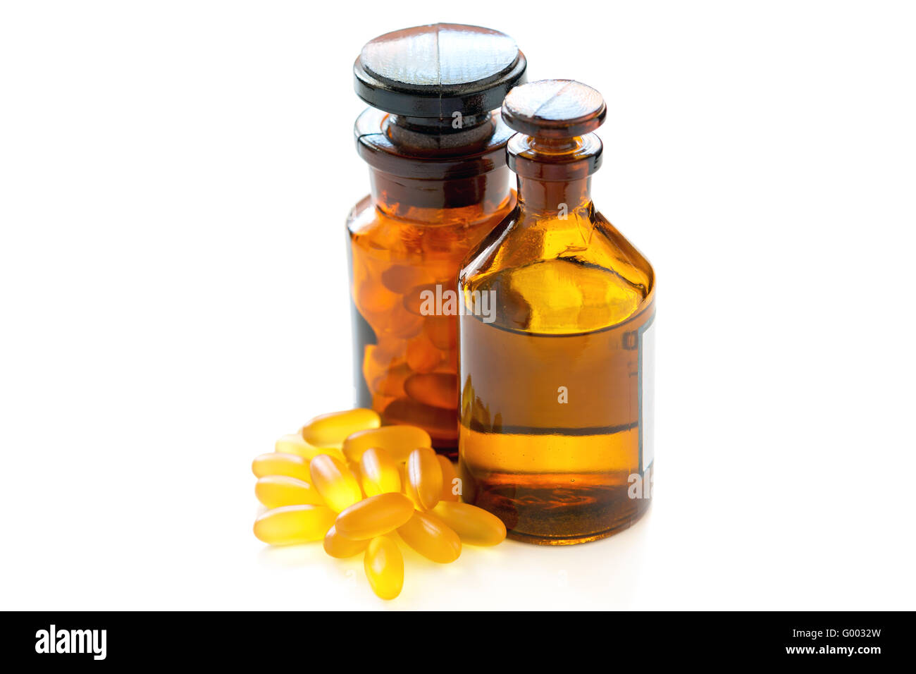 Fish oil in vial and capsules. Stock Photo