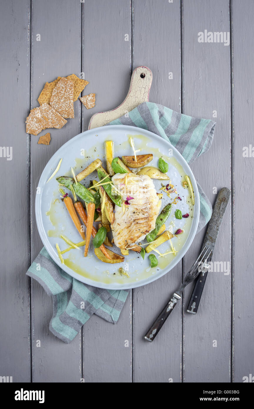 Codfish with Vegetable on Plate Stock Photo