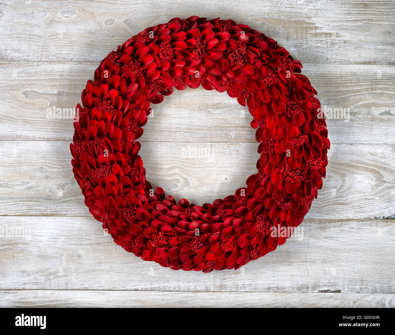 Wooden Red Wreath on White aged boards Stock Photo