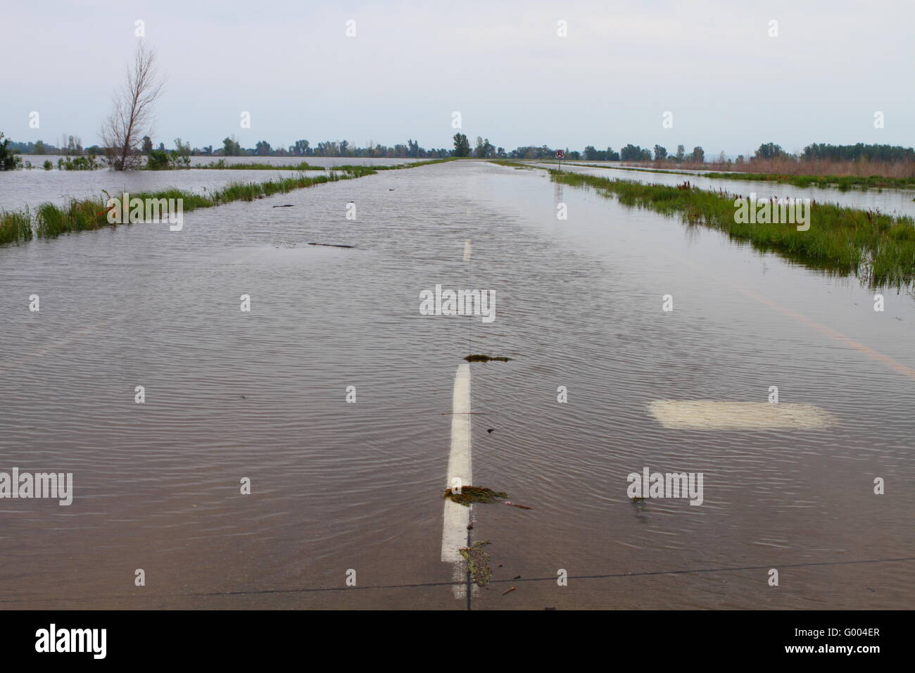 Highway in Midwest covered with flood water Stock Photo