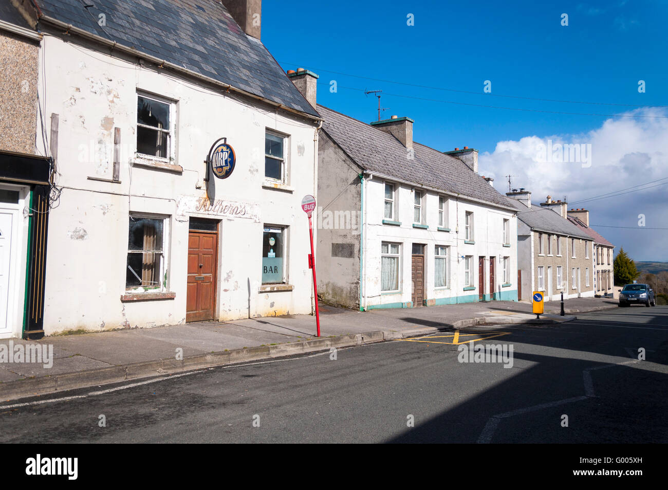 Closed bar and rundown houses on Main street, Mountcharles, County Donegal, Ireland Stock Photo