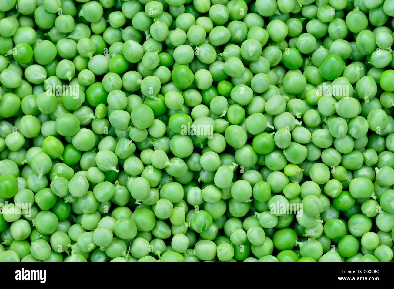 Background of fresh green peas Stock Photo