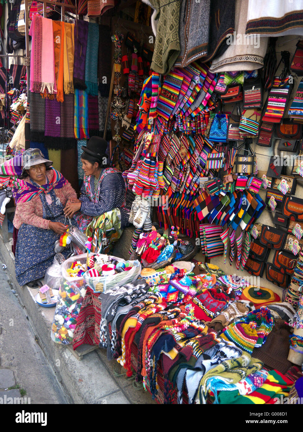 Women sitting out market stall in witches market La Paz Bolivia Stock Photo