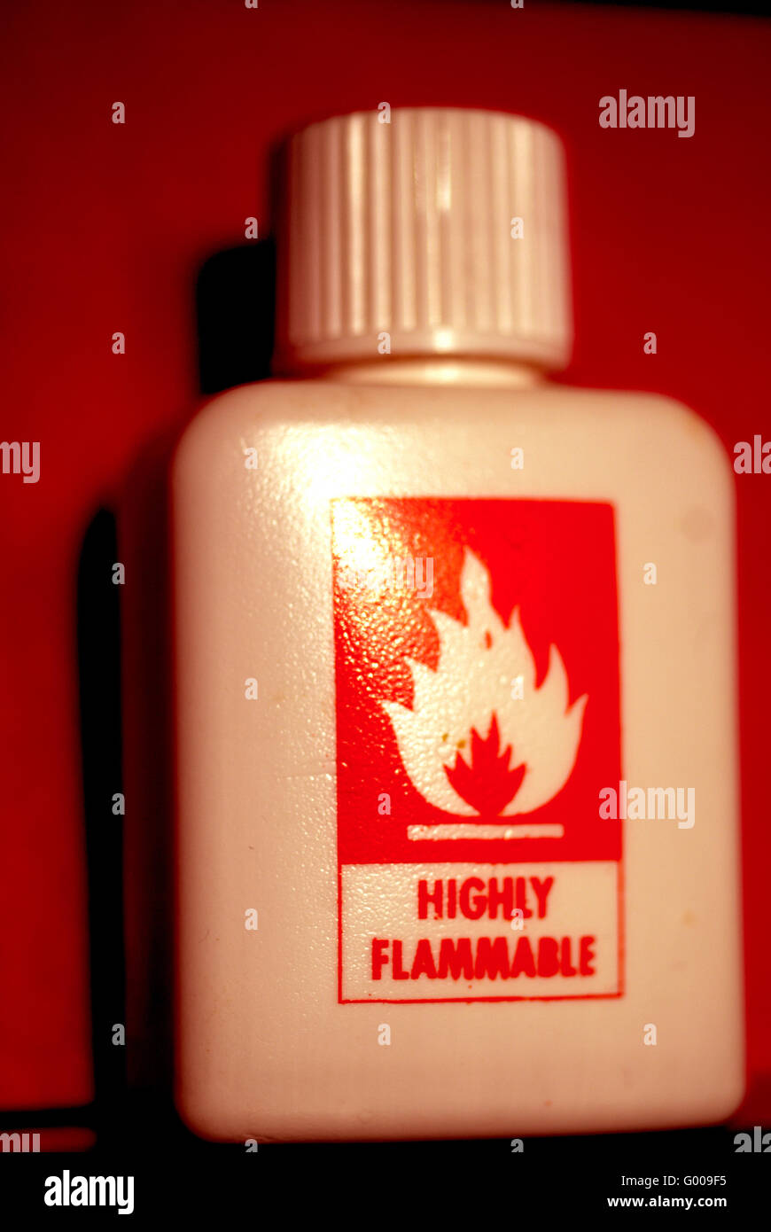 Highly Inflammable liquid in plastic bottle / Warning Stock Photo