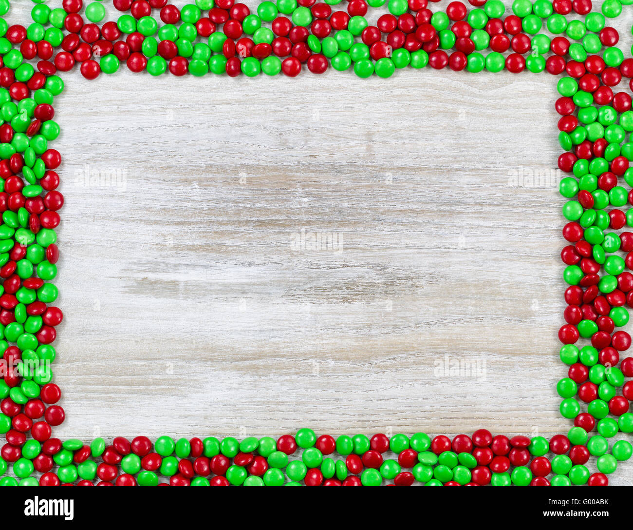 Red and Green candy border on wood Stock Photo