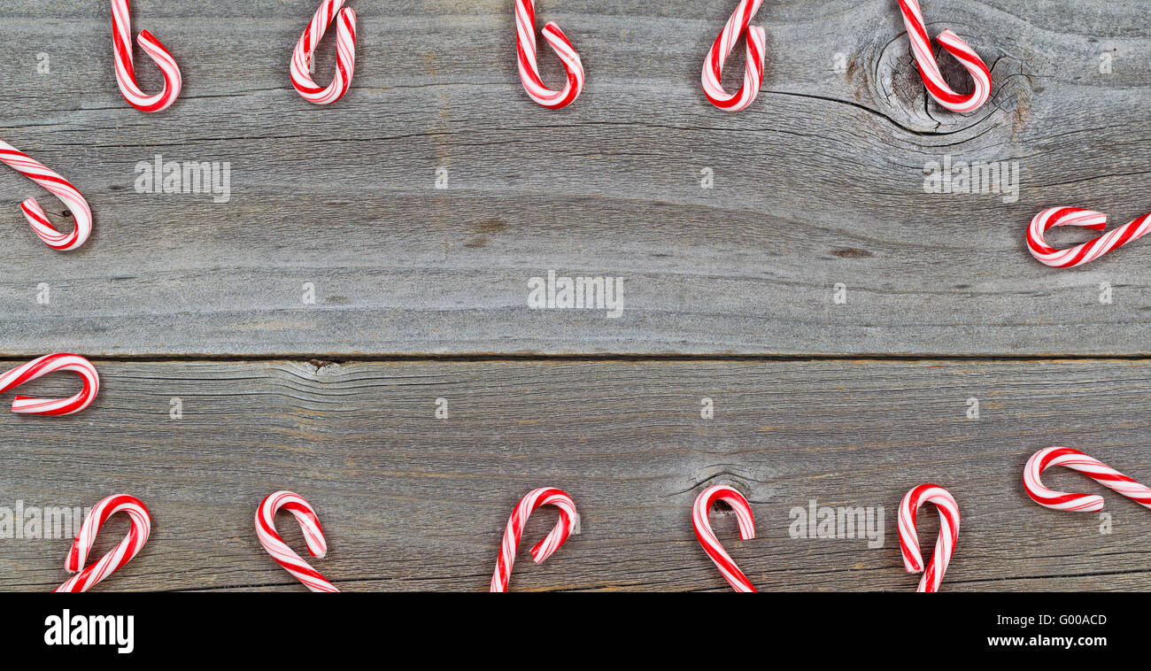 Candy Cane Border on rustic Wood Stock Photo