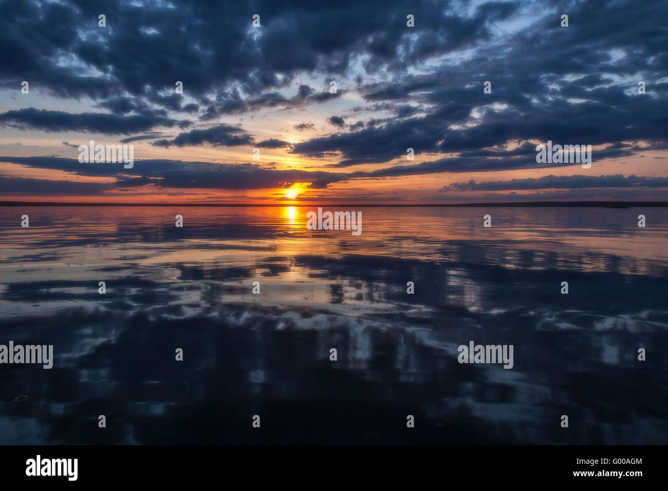 Lake reflected evening sky clouds hi-res stock photography and images ...