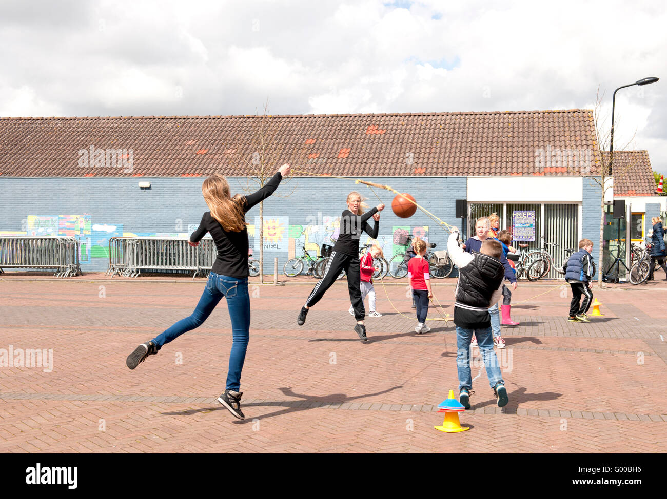 Children play with a ball in a schoolyard Stock Photo Alamy