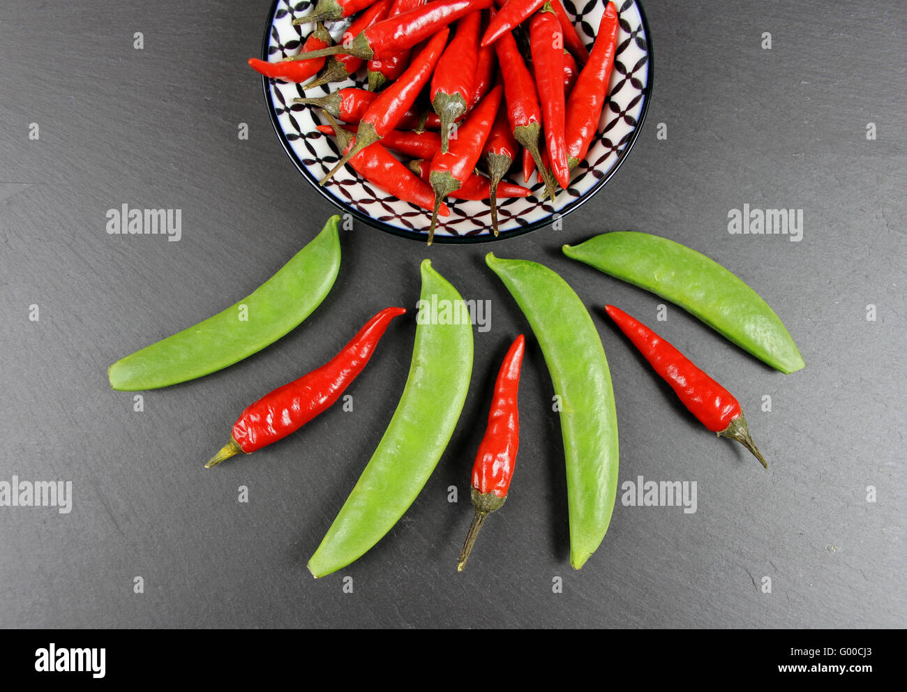 Chilis and snow peas Stock Photo
