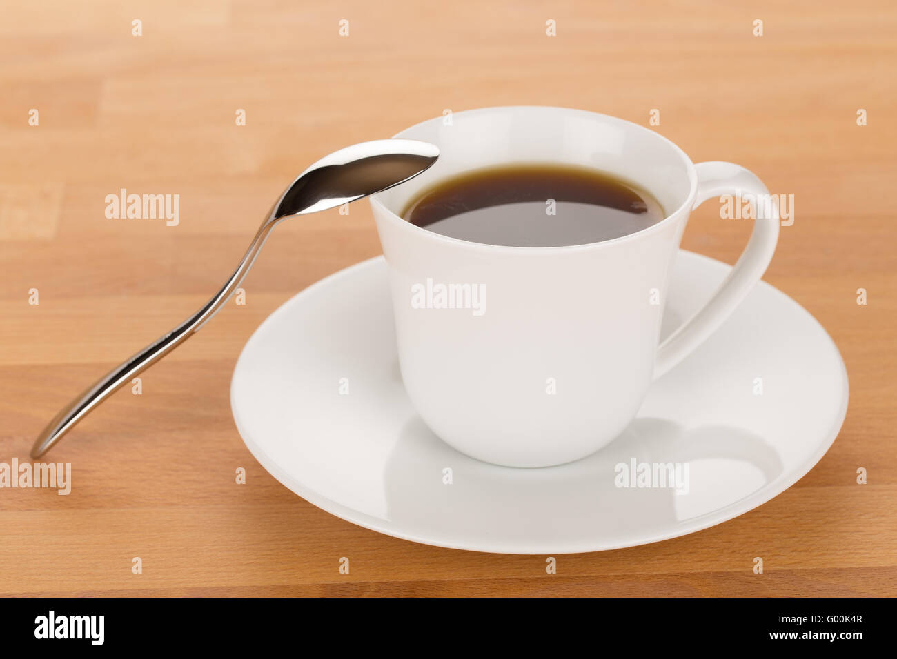 Cup of coffee and silver spoon Stock Photo