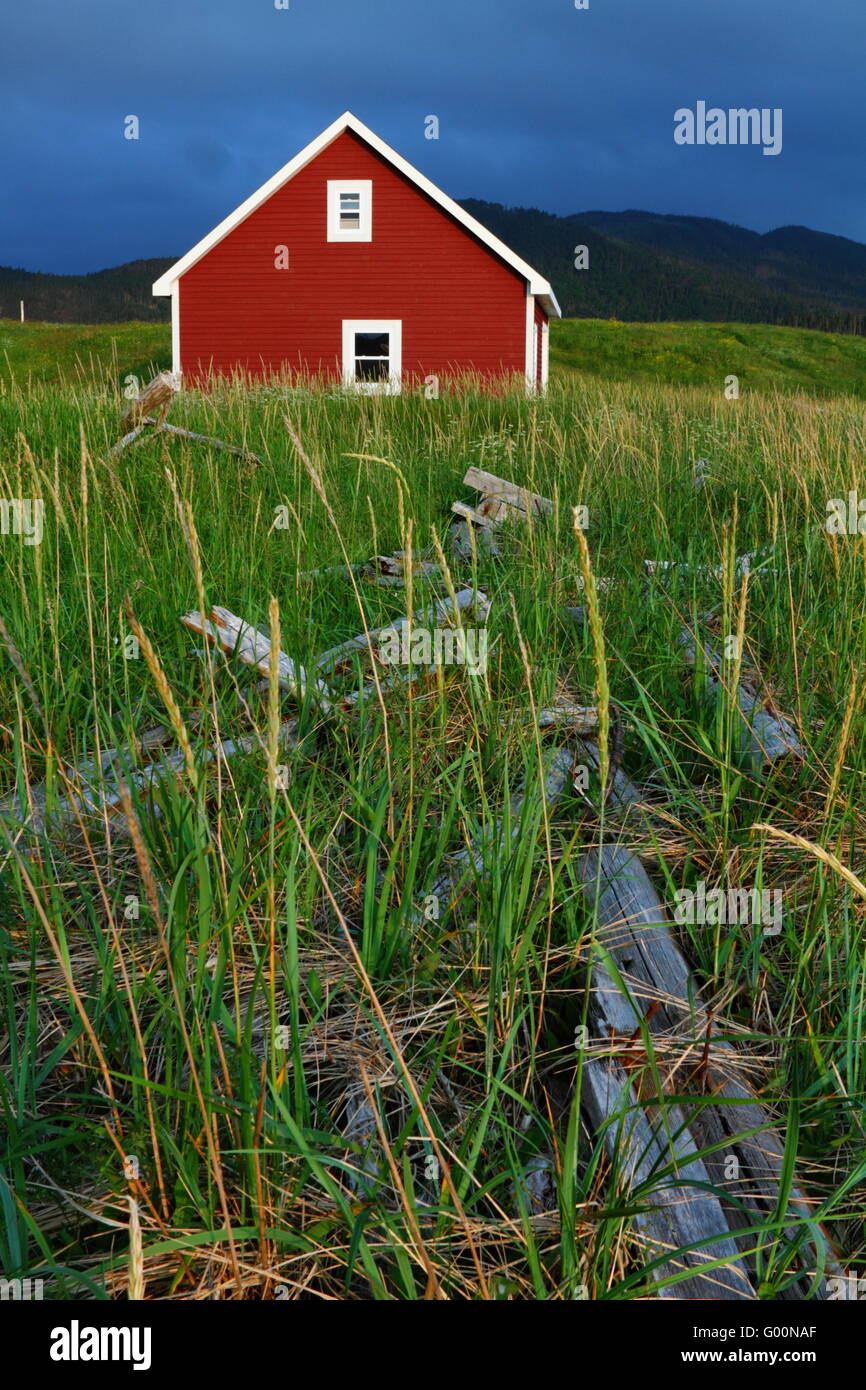 Red wooden cabin in Nordic landscape Stock Photo