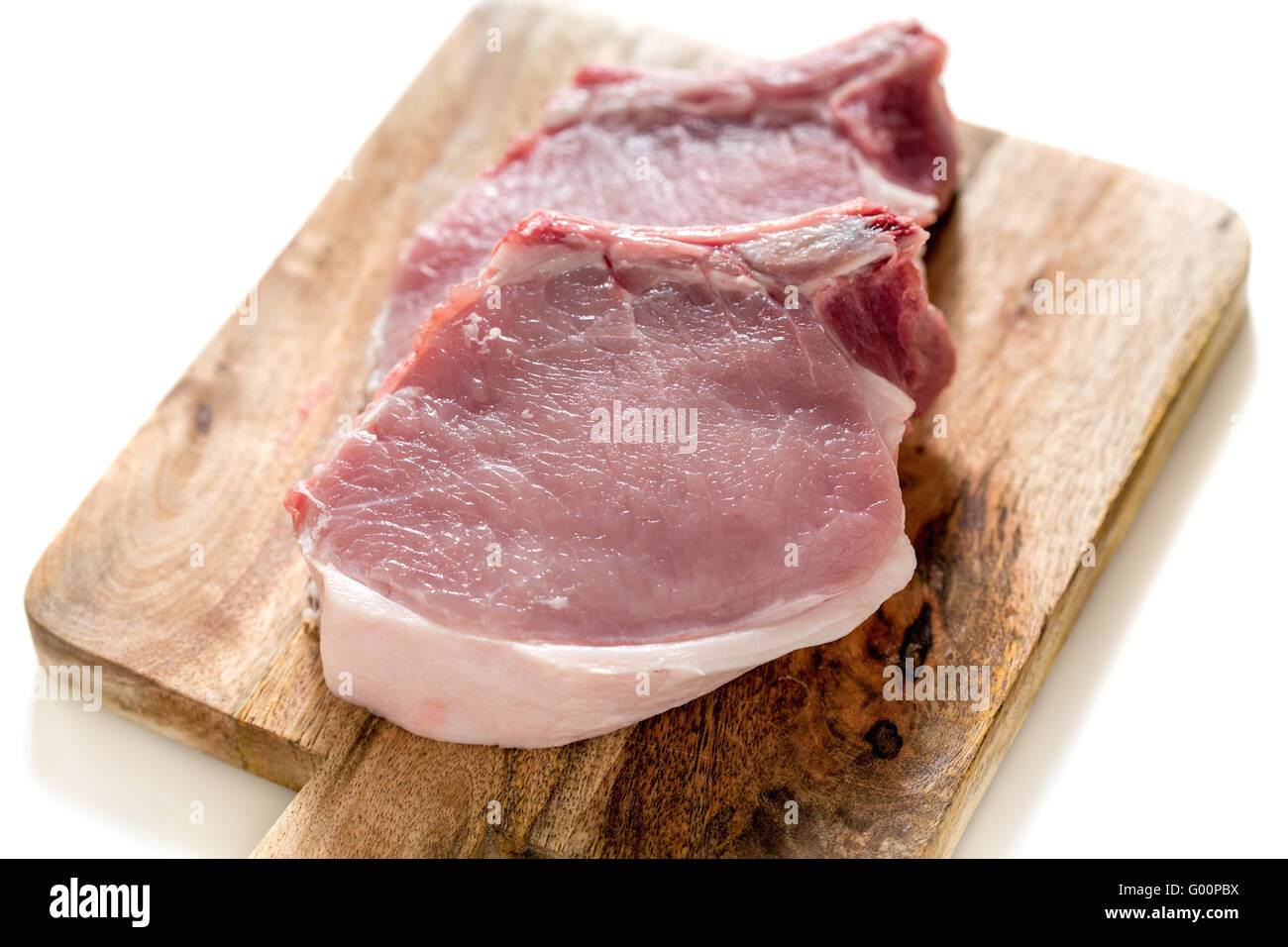 Chunks of pork loin on a cutting board. Stock Photo