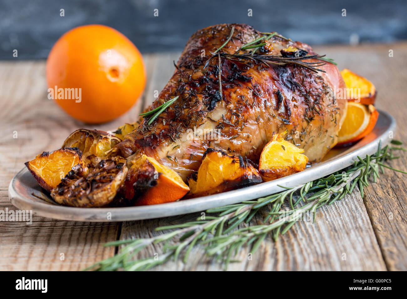 Thigh of turkey baked with oranges. Stock Photo