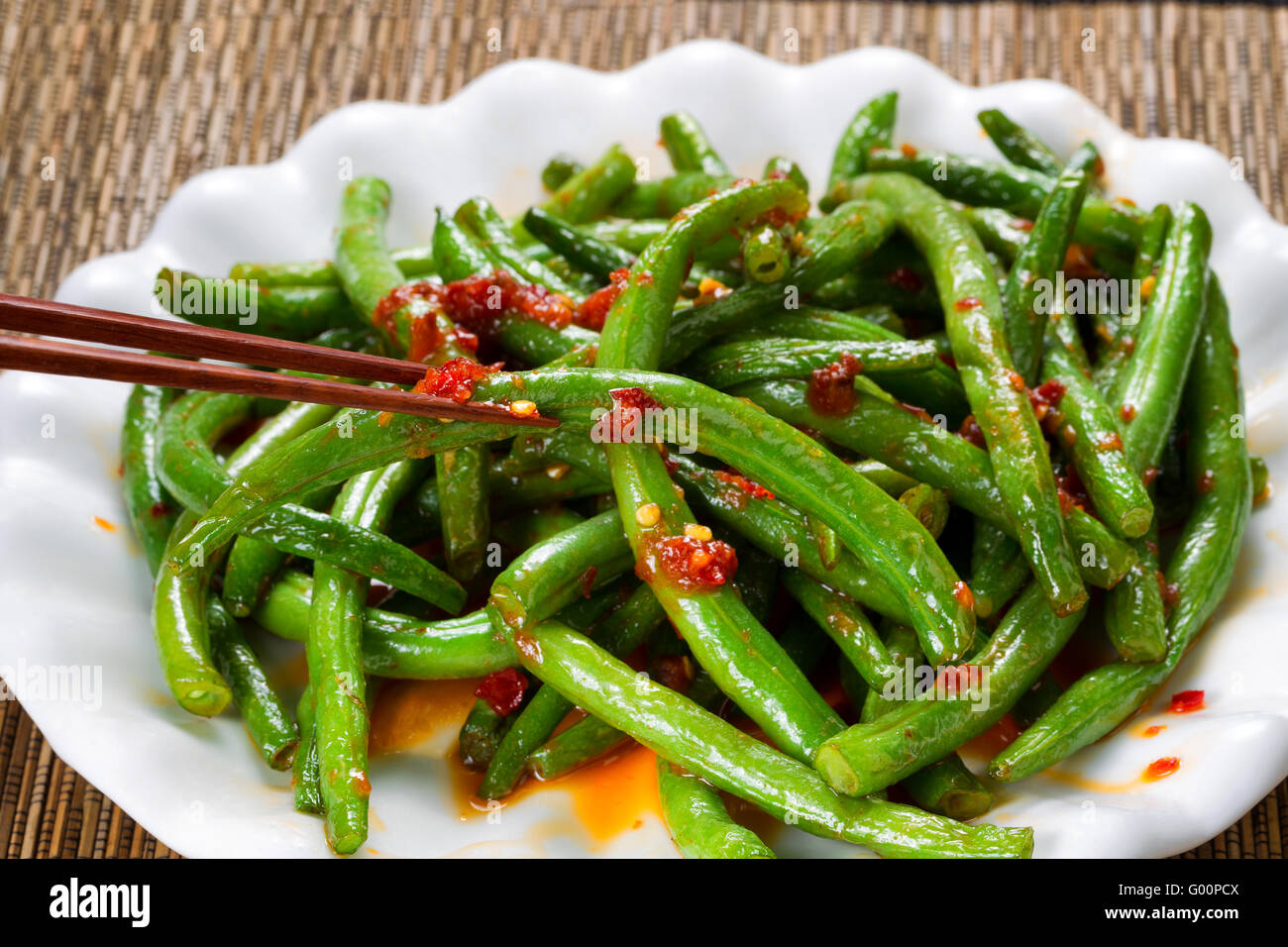 Cooked spicy greens in plate ready to eat Stock Photo