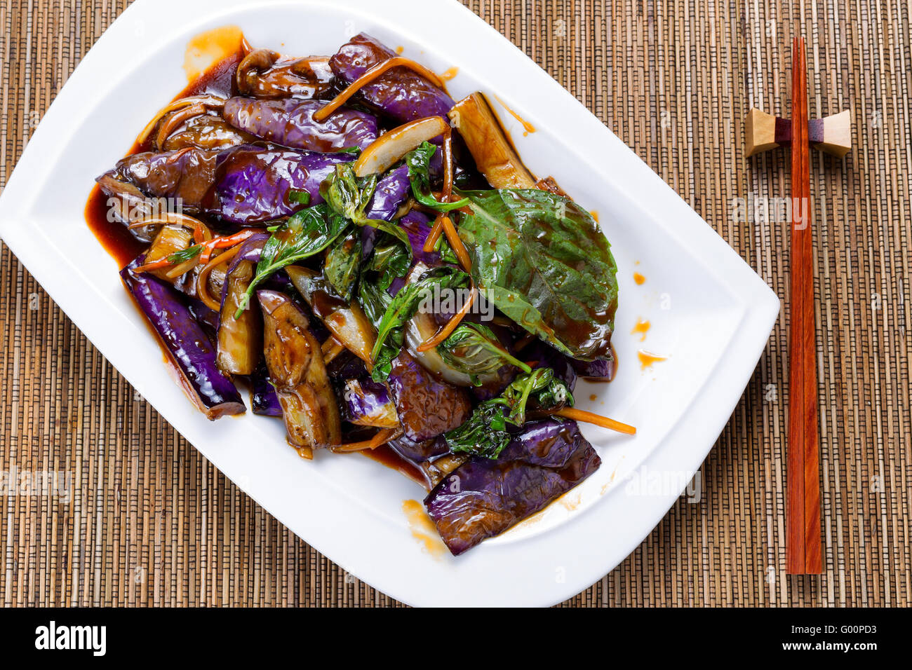 Prepared juicy eggplant and basil herb dish Stock Photo