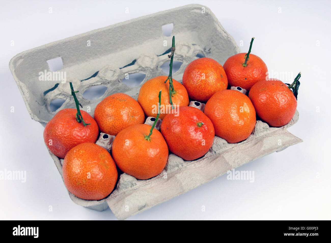 Tangerines in a egg carton Stock Photo