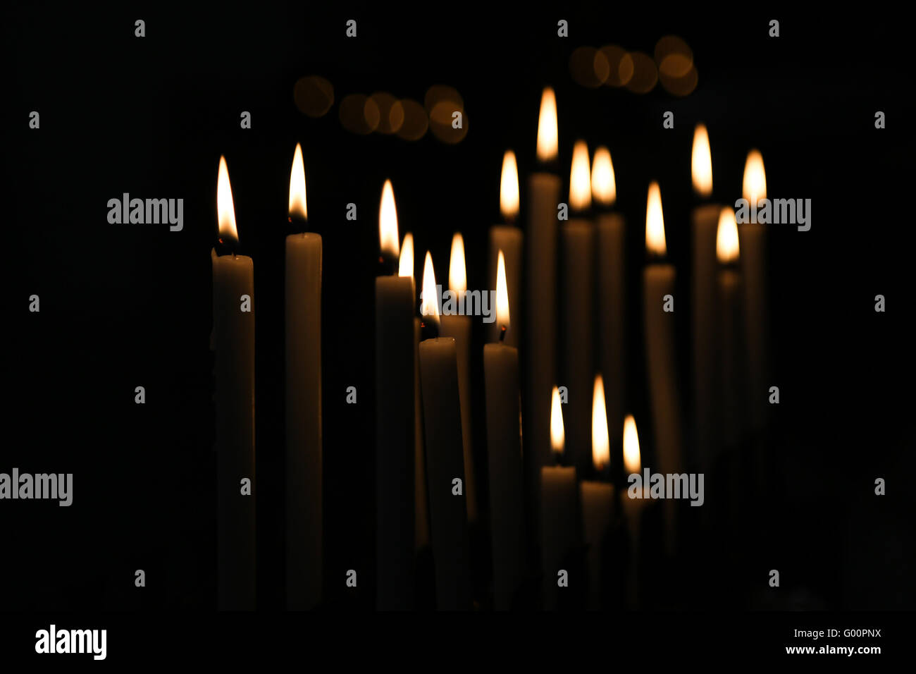 White Candle flames with black background Stock Photo Alamy