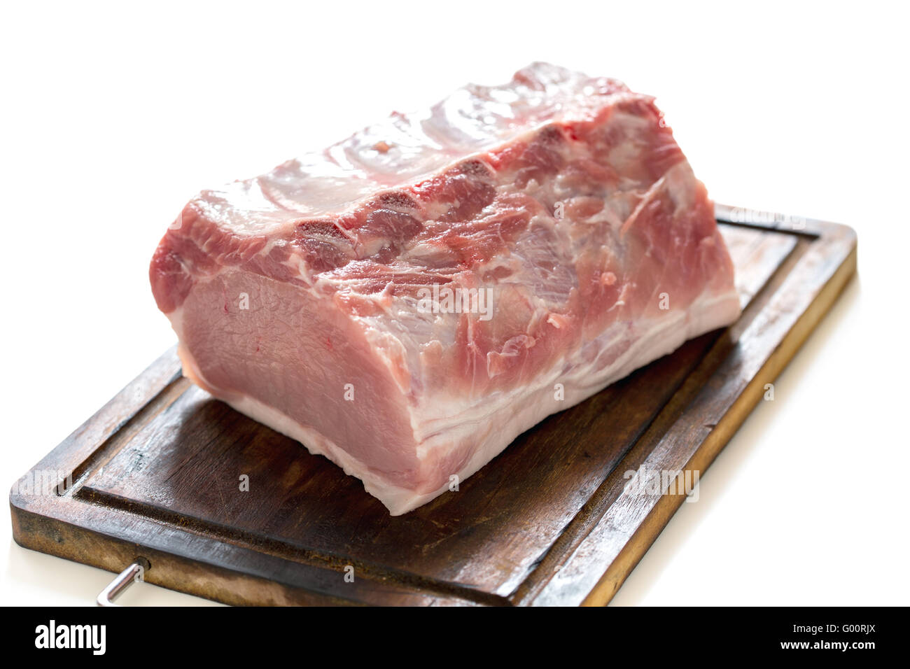 Cutting board with a pork loin. Stock Photo