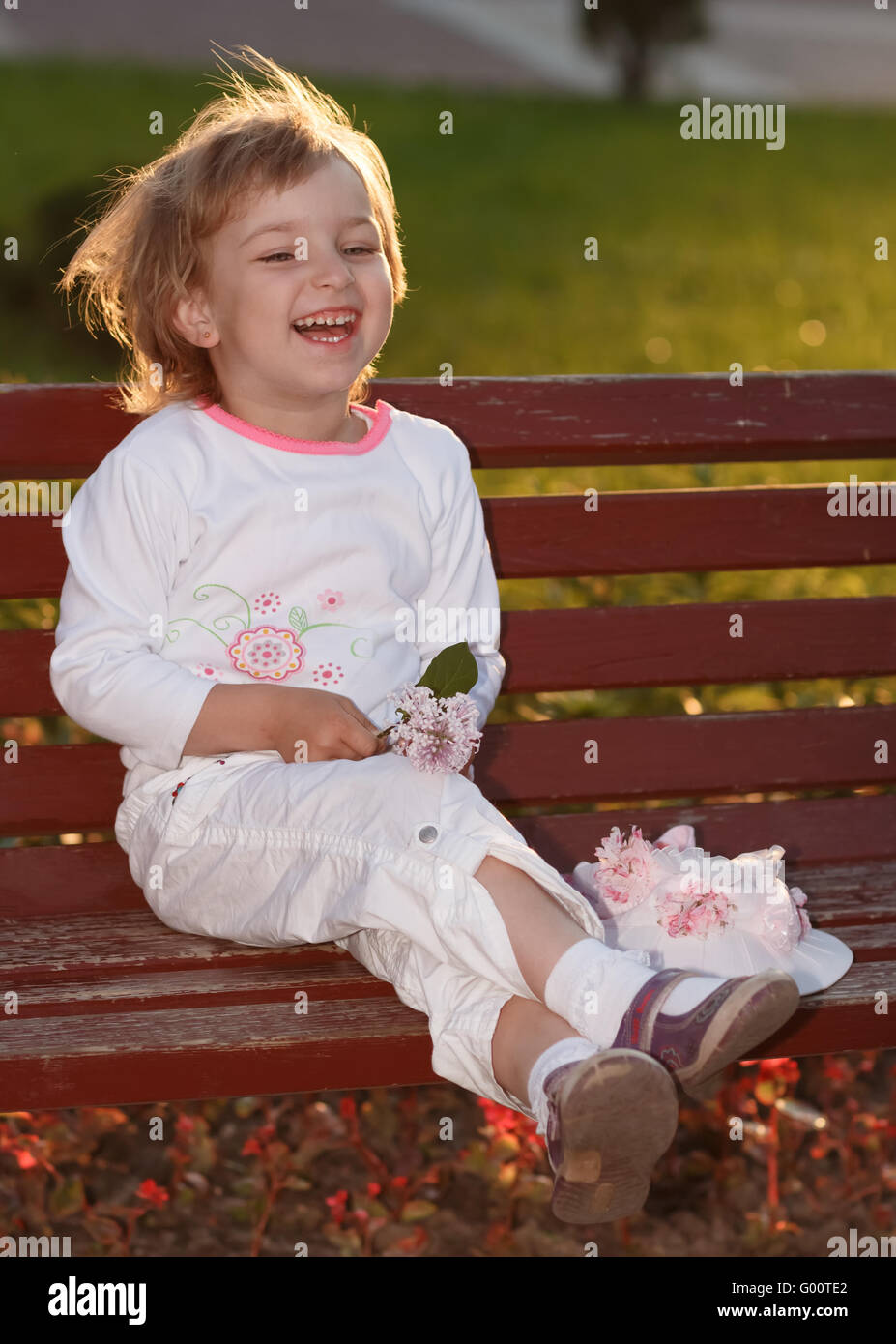 The girl in park on a bench Stock Photo - Alamy