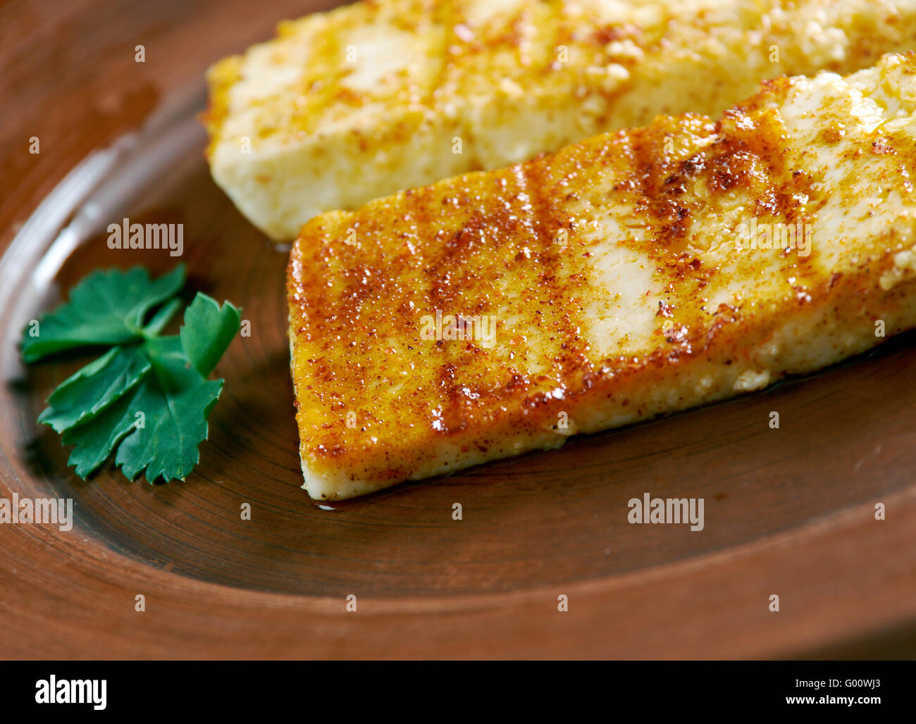 Grilled  Halloumi -  Cypriot semi-hard, unripened brined cheese. popular in the Levant, Greece and Turkey Stock Photo