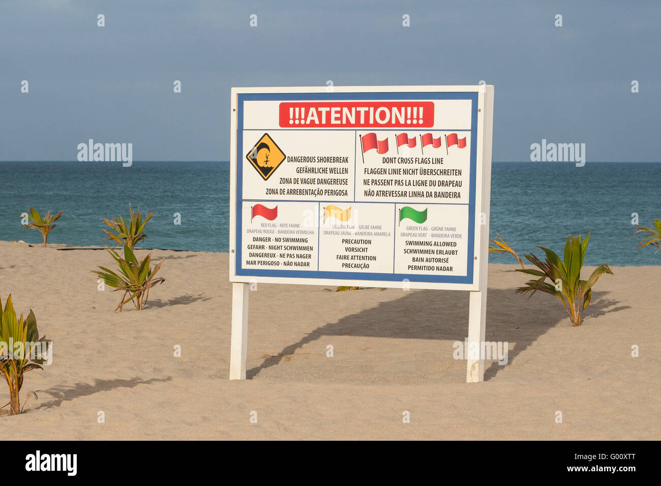 Sign on beach giving sea condition warnings to swimmers, Boa Vista, Cape Verde Stock Photo