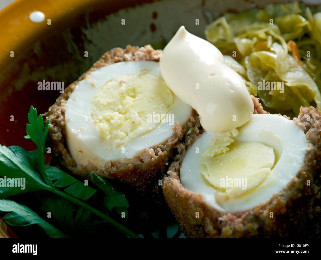 albondigas sorpresa Hardboiled egg wrapped in sausage meat.Spanish