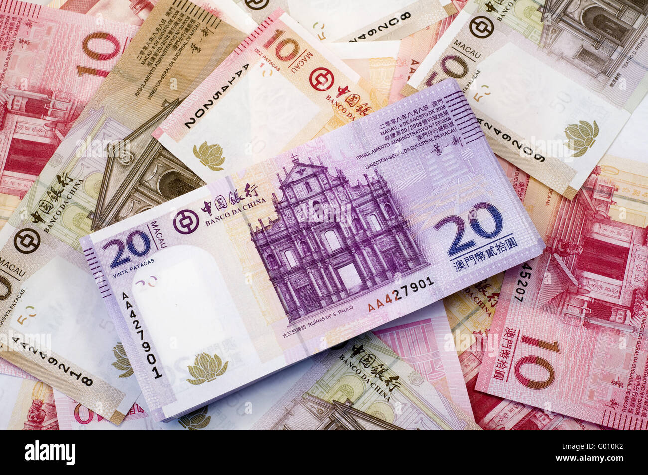 The stack of Macau Patacas (notes) and background Stock Photo