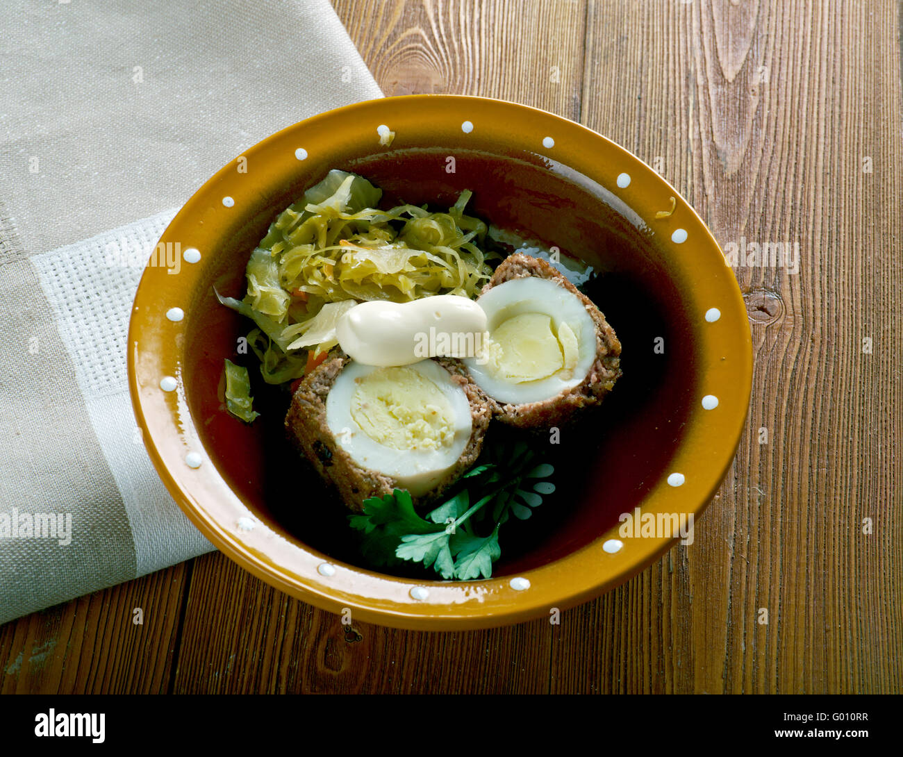 albondigas sorpresa Hardboiled egg wrapped in sausage meat.Spanish