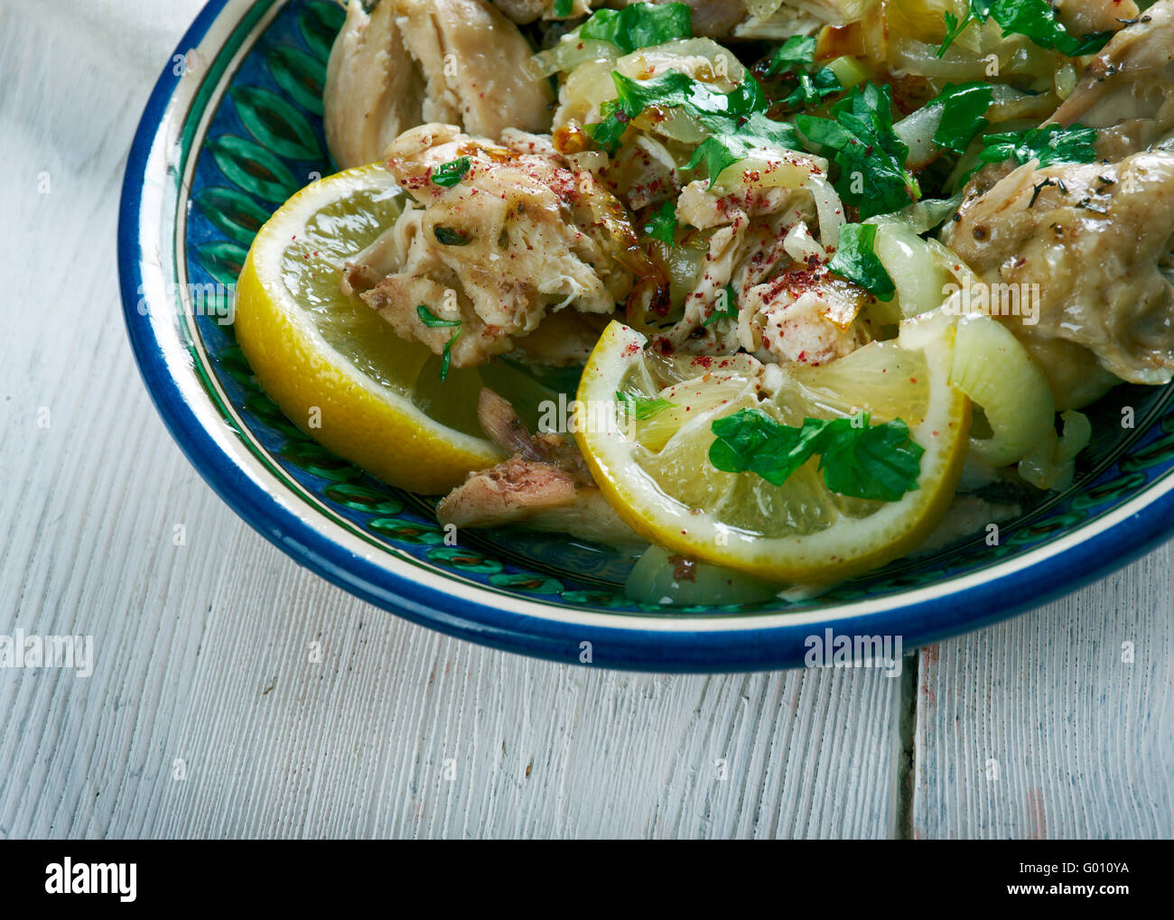 Moroccan Chicken Place the onion, parsley, coriander, lemon juice, garlic, cumin Stock Photo