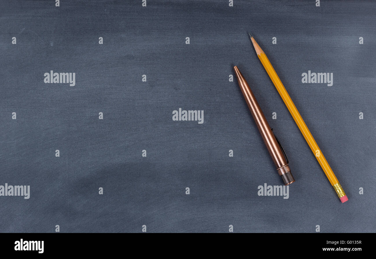 Wiped down blackboard with pen and pencil Stock Photo Alamy