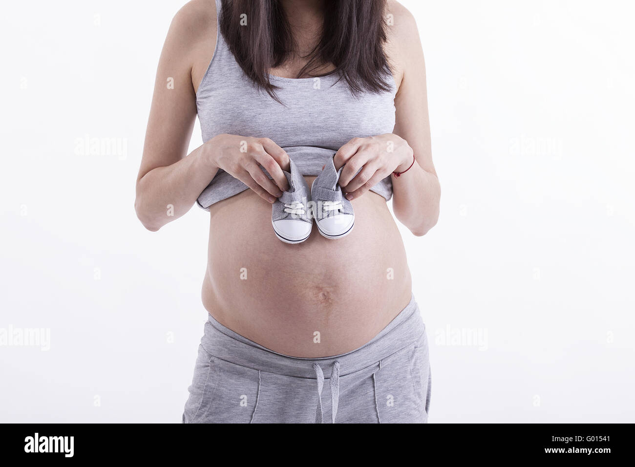 Small shoes for the unborn baby Stock Photo