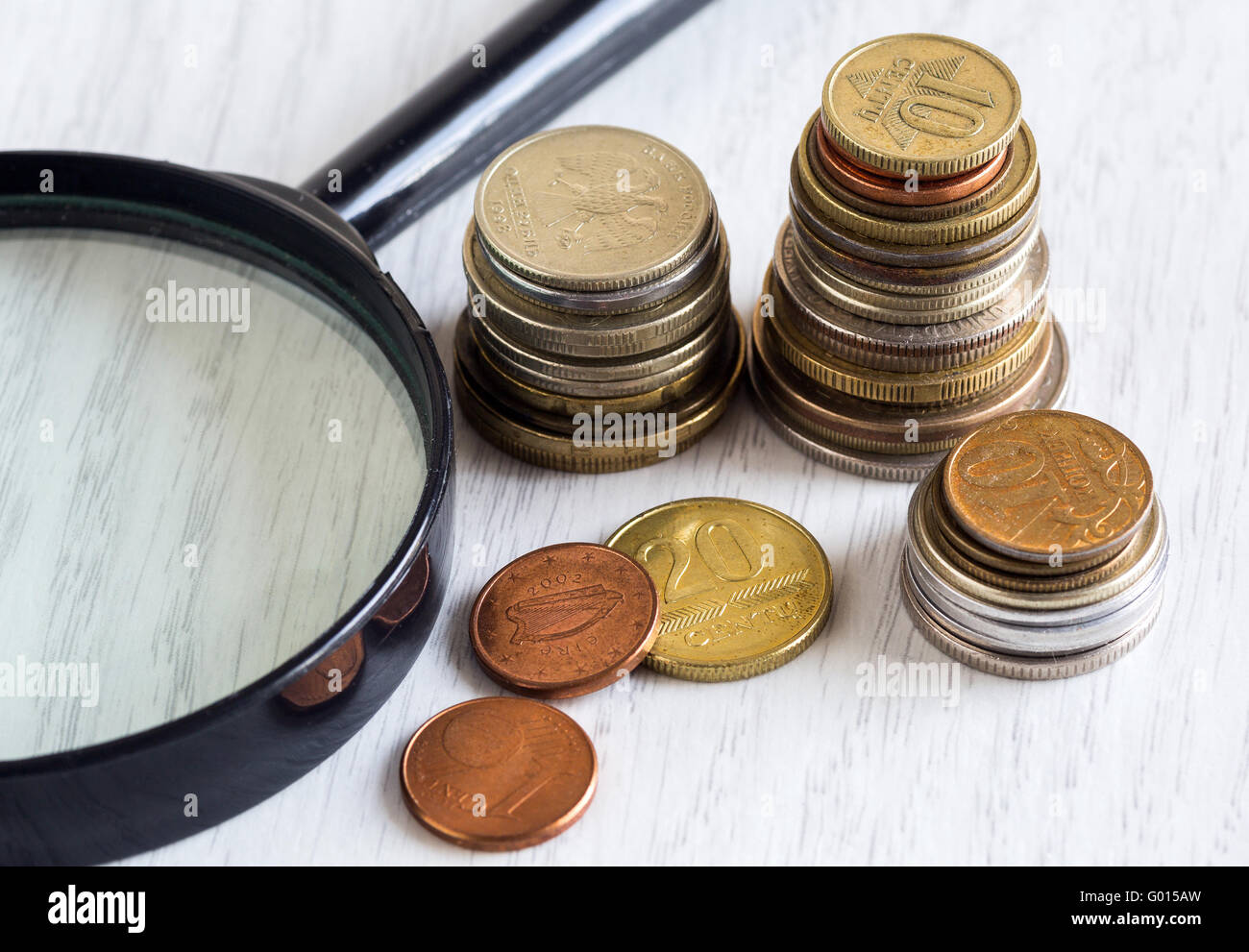coins and magnifying glass Stock Photo Alamy