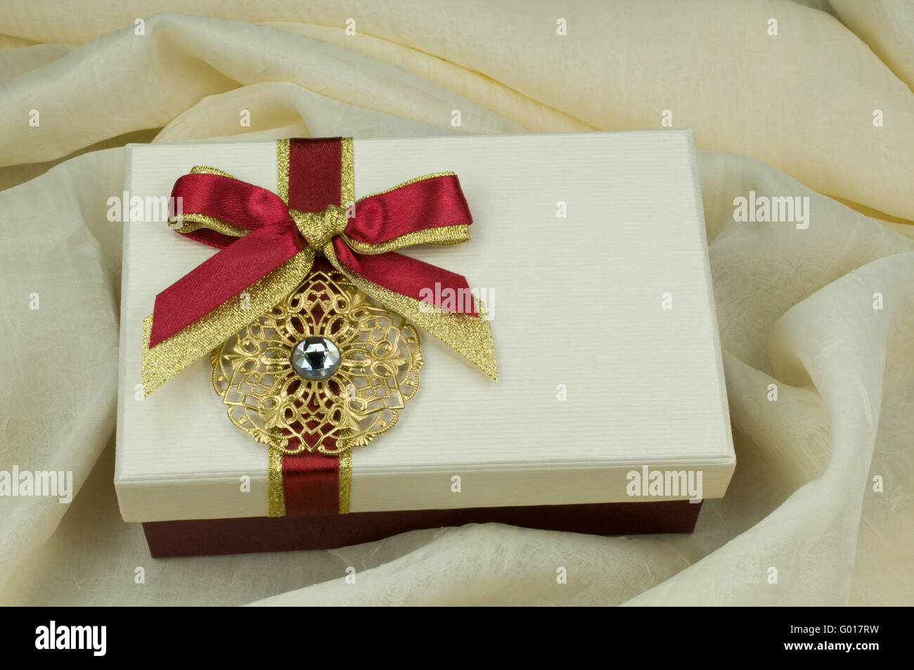 Present box with red ribbon Stock Photo - Alamy