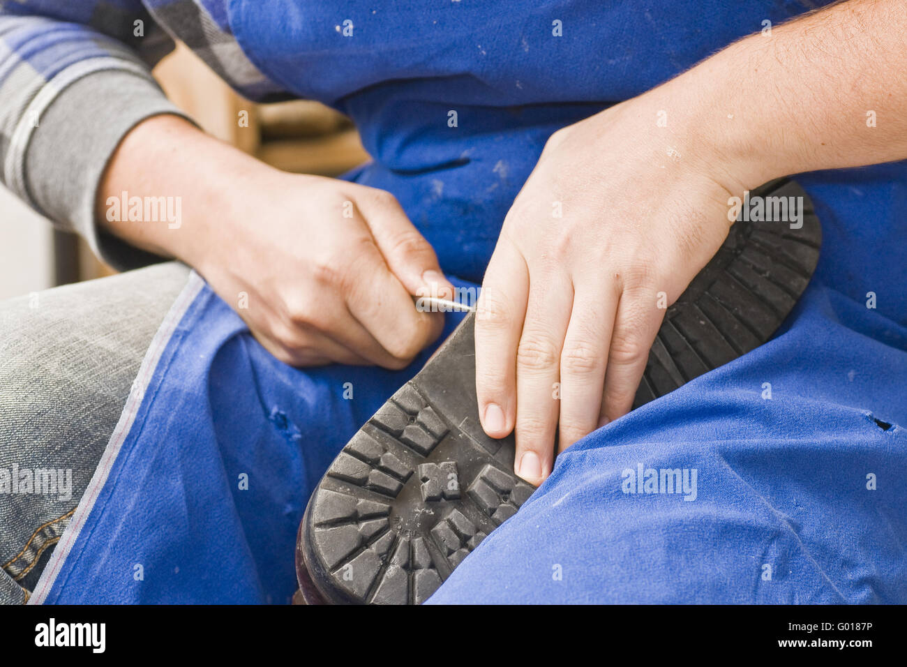 working shoemaker Stock Photo