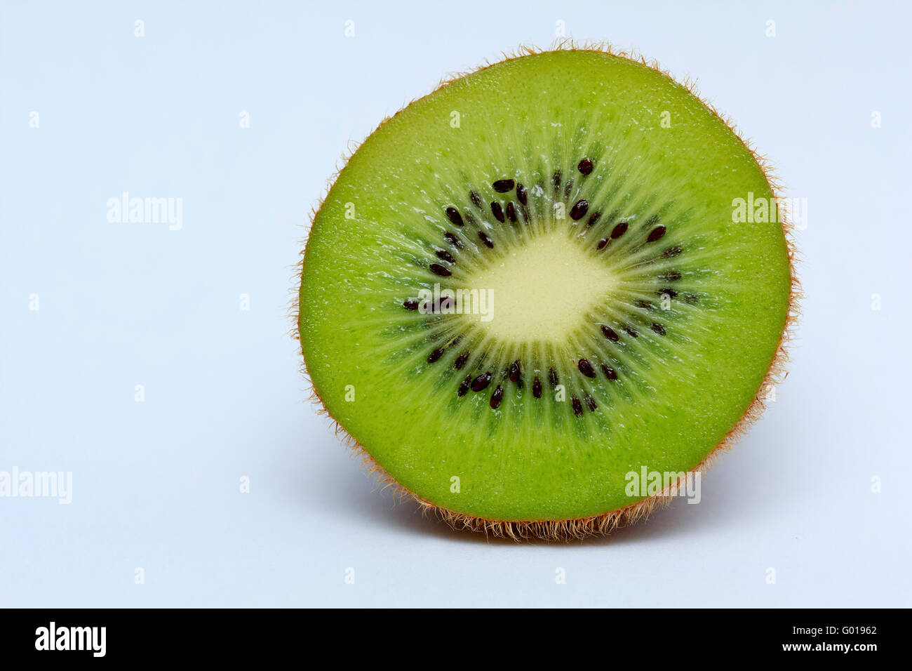 Half of kiwi fruit isolated on white background close up Stock Photo
