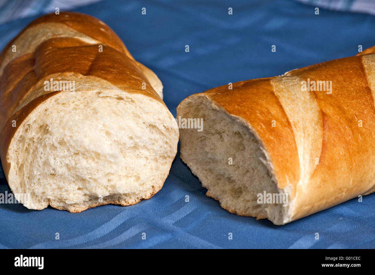 Broken loaf of French bread Stock Photo Alamy