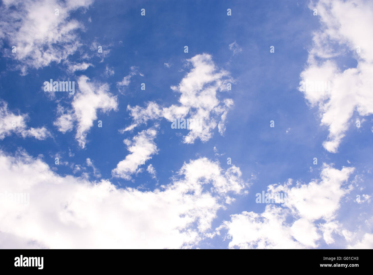 Bright white clouds with a deep blue sky background Stock Photo - Alamy