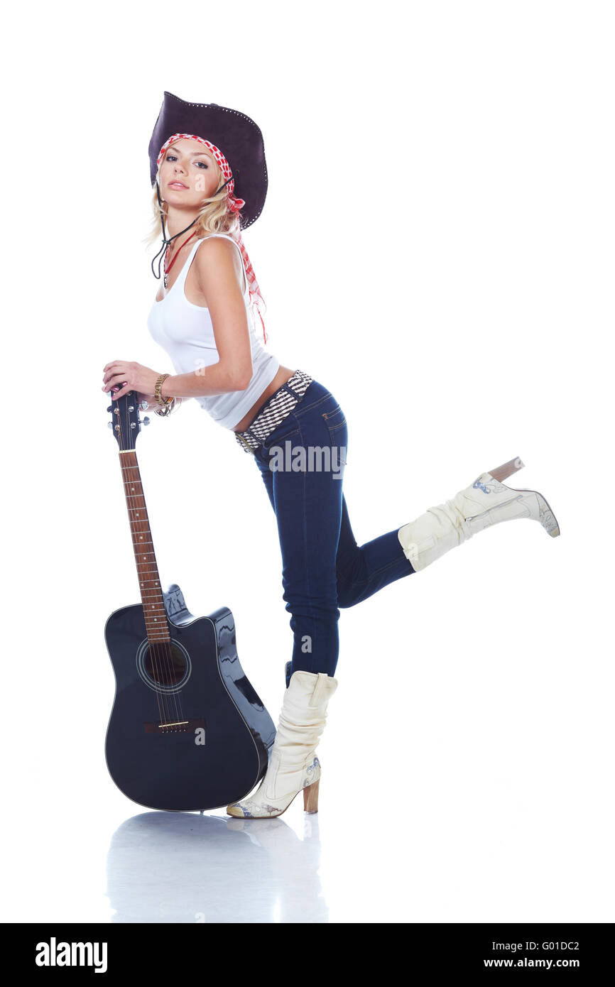 Cow-girl holding an acoustic guitar, isolated on white Stock Photo