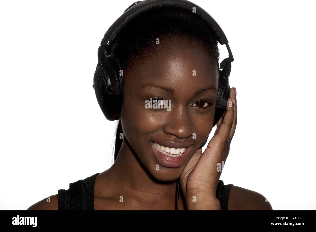 Beautiful young woman rocking out to music on her headphones Stock ...