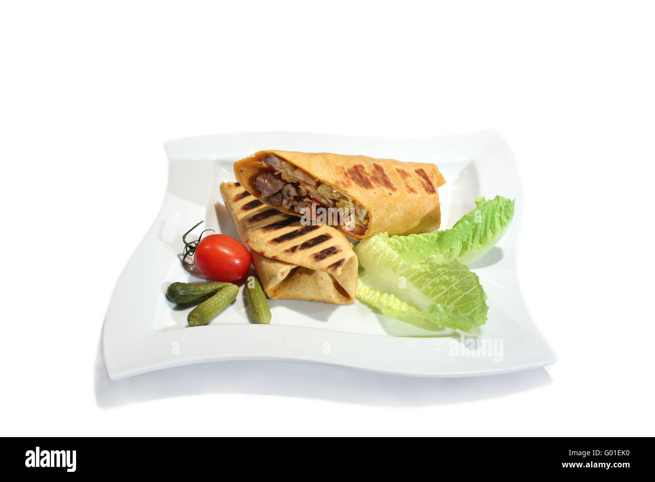 Grilled burrito with beef decorated by tomato Stock Photo Alamy