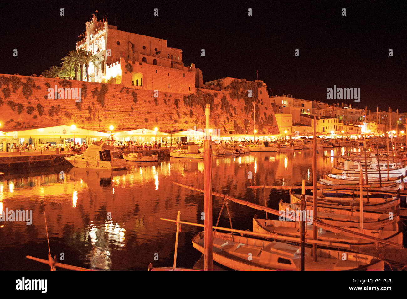 Menorca, Balearic Islands, Spain, Europe: skyline and panoramic night view of the port and the ancient walls of Ciutadella, the former capital city Stock Photo